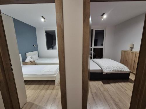 Ένα ή περισσότερα κρεβάτια σε δωμάτιο στο Sika Select Grand Apartment