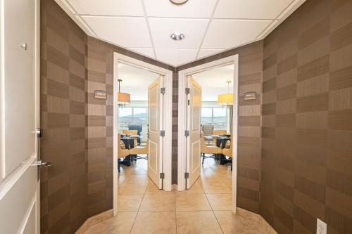 a hallway with a door leading to a dining room at The Grandview at Las Vegas in Las Vegas