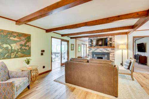 a living room with a couch and a fireplace at Deck and Game Room Mountaintop Hideaway in Tiger! in Tiger
