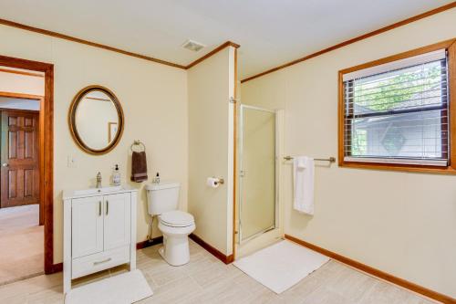 a bathroom with a toilet and a sink and a mirror at Deck and Game Room Mountaintop Hideaway in Tiger! in Tiger