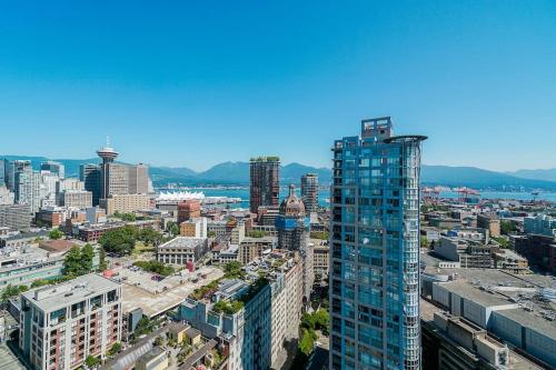 an aerial view of a city with tall buildings at Gorgeous Water View Unit in Downtown Vancouver in Vancouver