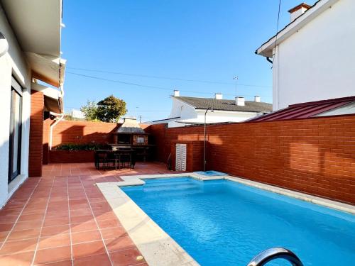 a swimming pool in the backyard of a house at By the Sea Mindelo Pool House in Vila Chã