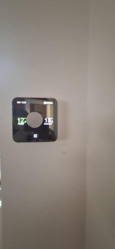 a tv is hanging on a wall at Modern 3 bedroom 2 bathroom Free Wifi Central Location in Middlesbrough