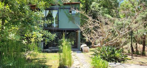 a tree house in the middle of a forest at Garden Suite in Valle de Bravo