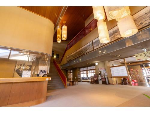 a lobby of a store with a staircase and aasteryasteryasteryasteryasteryastery at TAKAYANAGI JONNOBI VILLAGE - Vacation STAY 90863v in Kashiwazaki