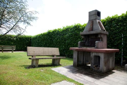 a park with a bench and a stoveasteryasteryasteryasteryasteryasteryasteryastery at Lo Scoiattolo Piedmont Bike Hotel in Pralormo