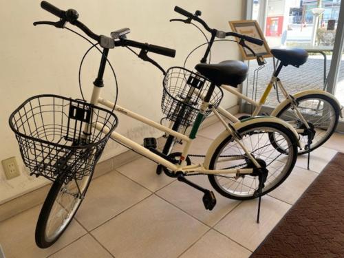 two bikes parked next to each other in a room at Smile Hotel Matsuyama - Vacation STAY 04507v in Matsuyama