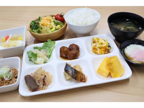 a plate with different types of food on a table at Sunnemu Hotel In Honjo - Vacation STAY 04605v in Yurihonjo