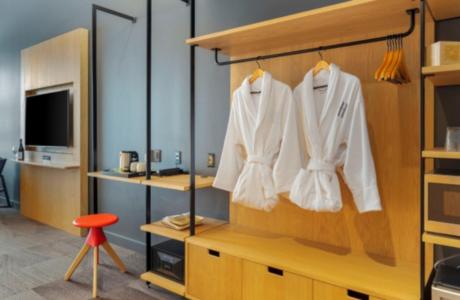 a room with white shirts hanging on a wall at Humbird Hotel in Sandpoint