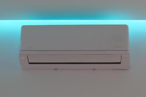 a close up of a air conditioner on a wall at Klea Rooms in Himare