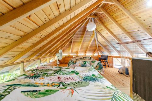 a bedroom with a large bed in a attic at Cabarete Boutique Kite Hotel for up to 15 people in Cabarete