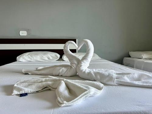 Postel nebo postele na pokoji v ubytování Oasis Praia Hotel