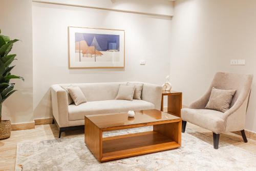 a living room with a couch and a coffee table at Elegance Tower in Cairo