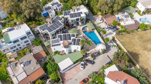 an overhead view of a house with solar panels on it at Orion hotel in Bodrum City