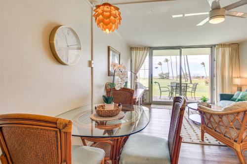 a dining room with a glass table and chairs at Gorgeous Oceanfront Condo with Spectacular Views! in Kihei