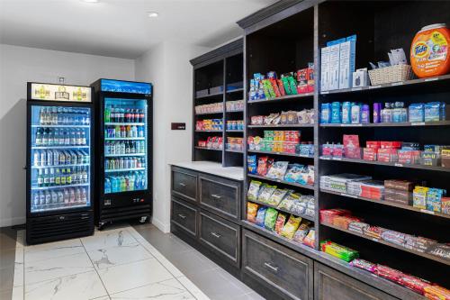 a grocery store aisle with shelves of food and drinks at Best Western Plus New Richmond Inn & Suites in New Richmond