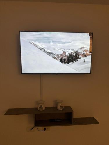 TV a/nebo společenská místnost v ubytování Moderno Apartamento Central