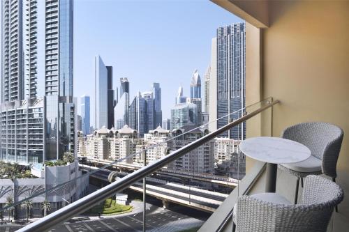 a balcony with a view of a city at Kempinski Central Avenue Dubai in Dubai