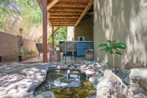 a patio with a koi pond in a yard at Desert Sunset-Private Hot Tub-Pet Friendly-No Pet Fee! in Albuquerque