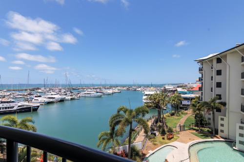 a view of a marina with boats in the water at Mantra Marina Hotel Room in Urangan