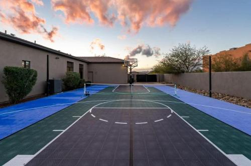 an empty basketball court in a backyard with a sky at HoZho Residence on Desert Views in Currys Corner