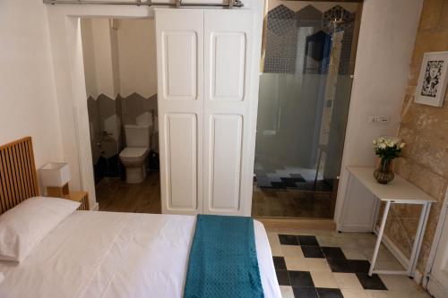 Letto o letti in una camera di Blue House 9 Rooms & Breakfast