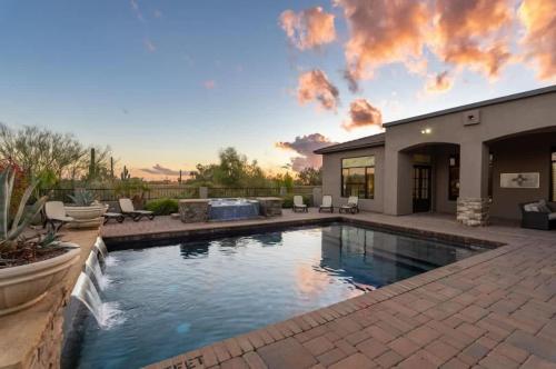 a swimming pool in the backyard of a house at HoZho Residence on Desert Views in Currys Corner