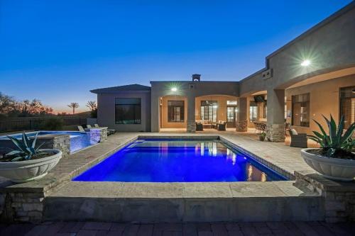 a swimming pool in the backyard of a house at HoZho Residence on Desert Views in Currys Corner