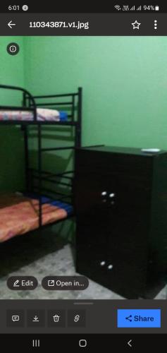 Postel nebo postele na pokoji v ubytování Medan Dazhong Backpacker's Hostel