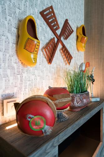 a wooden table with a plate of food and a instrument at Boutique Hotel im Auracher Löchl in Kufstein