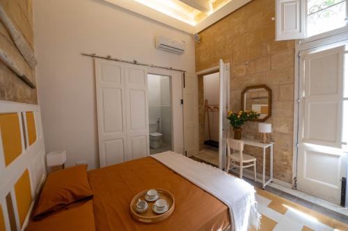 Letto o letti in una camera di Blue House 9 Rooms & Breakfast