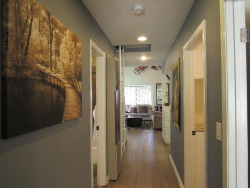 a hallway of a home with a painting on the wall at Big B's Den in Big Bear Lake