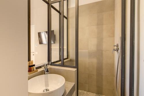 a bathroom with a sink and a shower at The Spanish Suite Campo de' Fiori in Rome