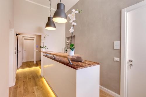 a kitchen with a counter top in a room at The Spanish Suite Campo de' Fiori in Rome