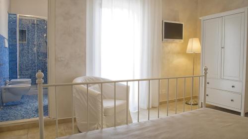 Ένα ή περισσότερα κρεβάτια σε δωμάτιο στο Relais La Pretura