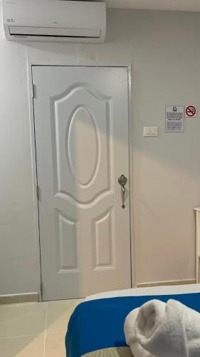 a door in a room with a white door at JM 257 Gh in Santo Domingo