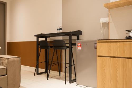 Η κουζίνα ή μικρή κουζίνα στο Bay Suites by Pinstay Plus