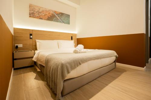 Ένα ή περισσότερα κρεβάτια σε δωμάτιο στο Bay Suites by Pinstay Plus