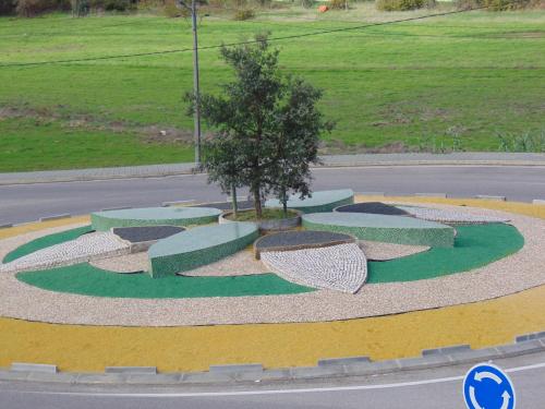 a circle of benches on the side of a road at Residencial as Canárias in Ponte de Sor