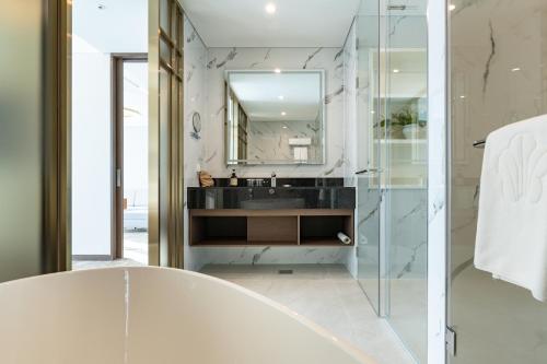 a bathroom with a sink and a mirror at Stanford hotel Andong in Andong