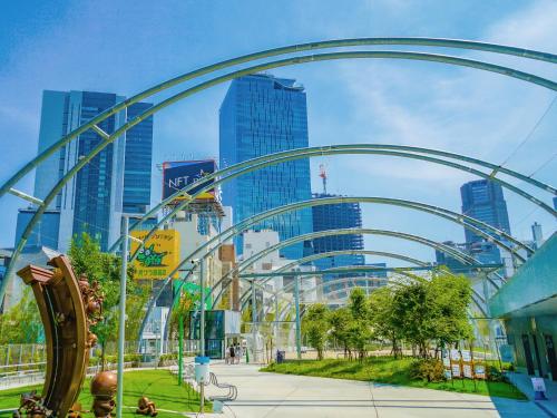 a roller coaster in a city with tall buildings at Shibuya Creston Hotel in Tokyo