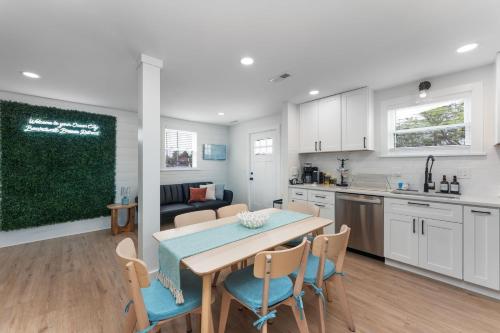a kitchen and dining room with a table and chairs at New Beach House with Game Room in Ocean City