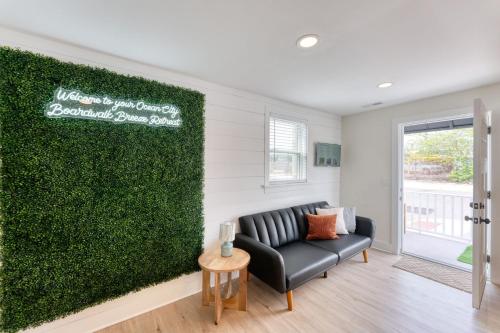 a living room with a couch and a green wall at New Beach House with Game Room in Ocean City