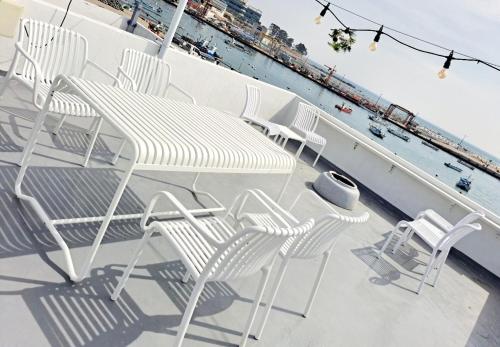 a group of chairs and a table on a cruise ship at Narae House in Busan