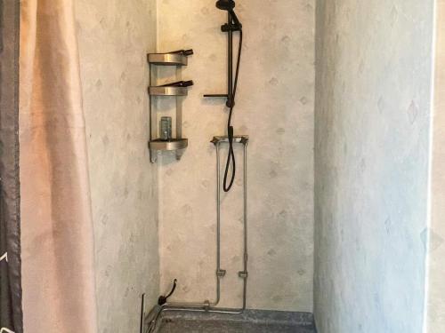 a shower in a bathroom with aanding shower at Countryside retreat for 4 guests in Skånes Fagerhult