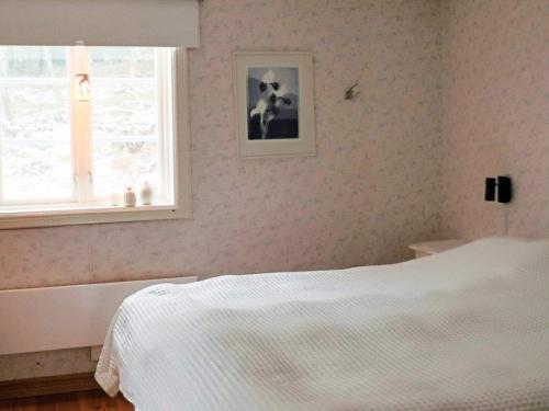 En eller flere senge i et værelse på 3 bedroom holiday home with sauna