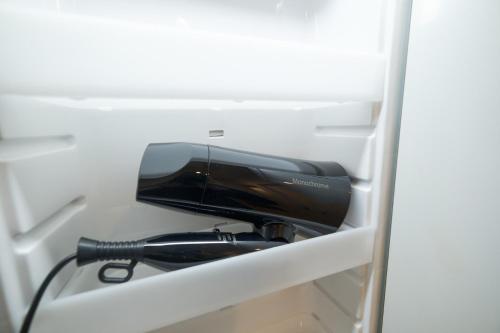 a hair dryer is sitting in a refrigerator at Z LAND Enoshima in Fujisawa
