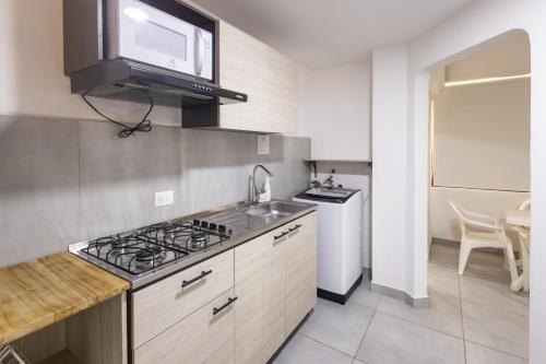 Η κουζίνα ή μικρή κουζίνα στο Cozy apartment in bocagrande