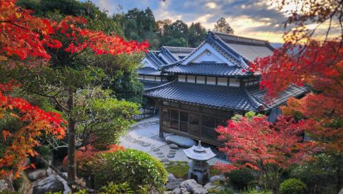 an asian house in the middle of a garden at Samurai Manner -Tea House in Soida