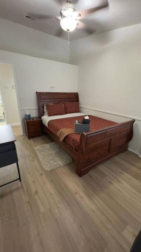 a bedroom with a large bed and a ceiling at 3BR & Loft near Palmdale Hospital- Shared Hm in Palmdale